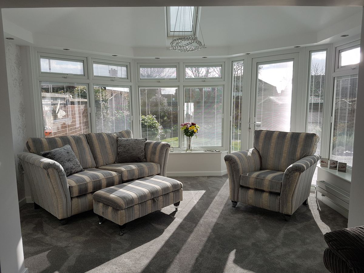 Cosy lounge under a tiled roof with roof window