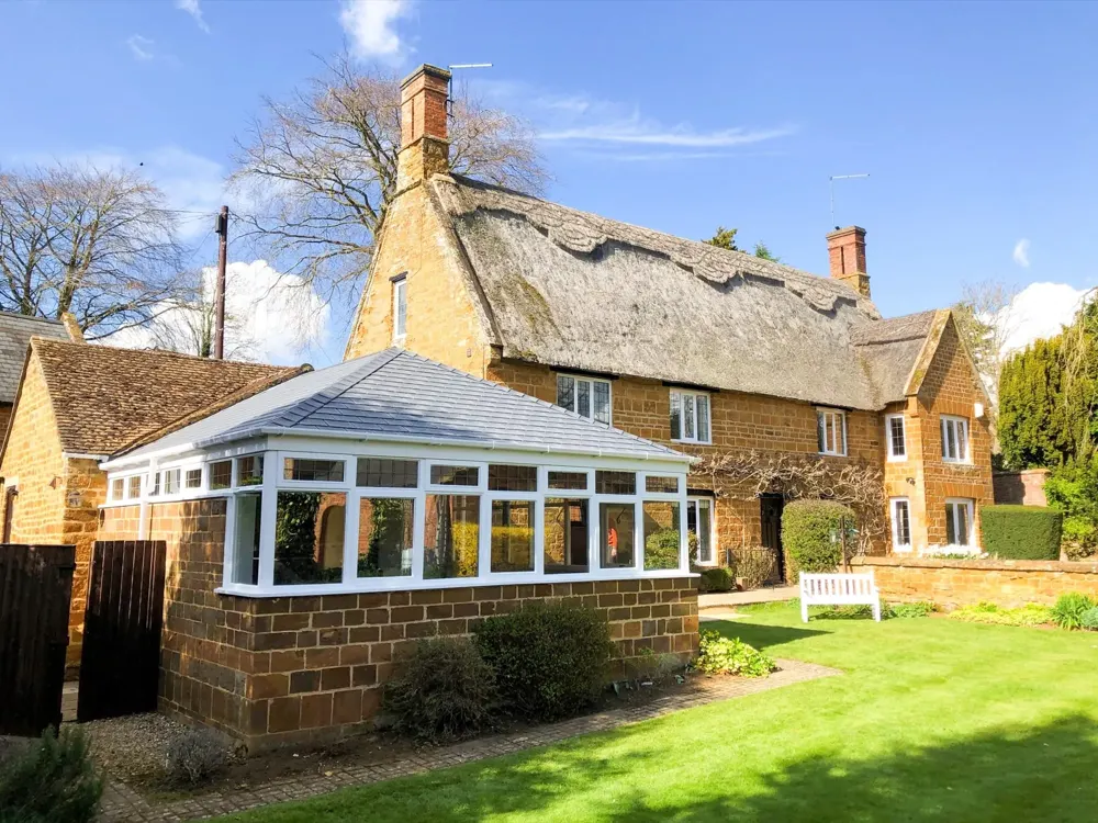 Edwardian conservatory with a slate-effect tiled roof fitted by Nu-Look