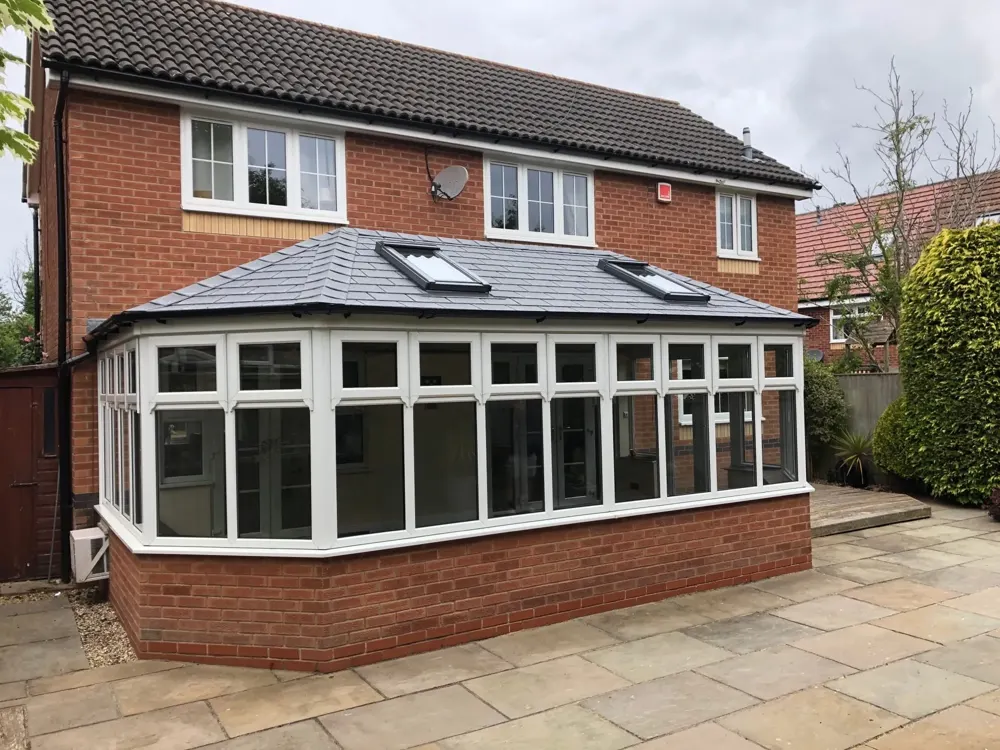 Double hipped Victorian conservatory with a slate-effect tiled roof fitted by Nu-Look