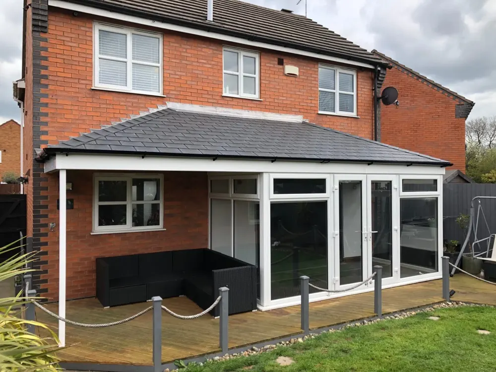 Hipped Lean to conservatory with a tiled roof fitted by Nu-Look